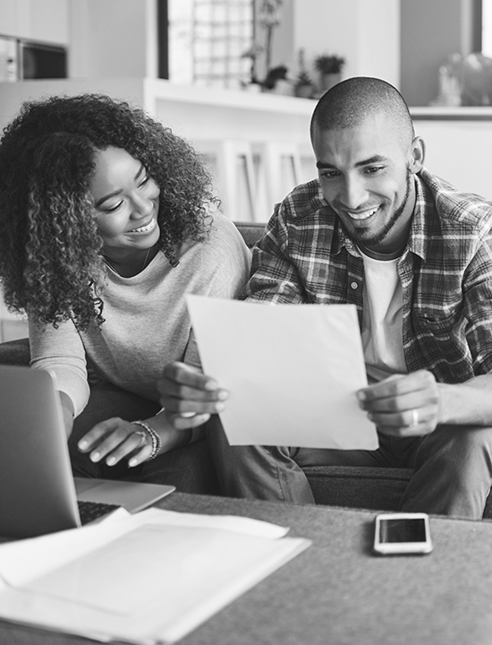 Couple at home doing taxes