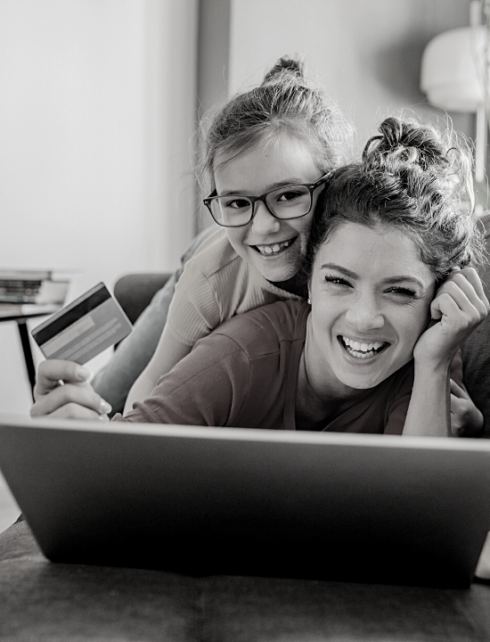 mom and daughter online shopping with credit card