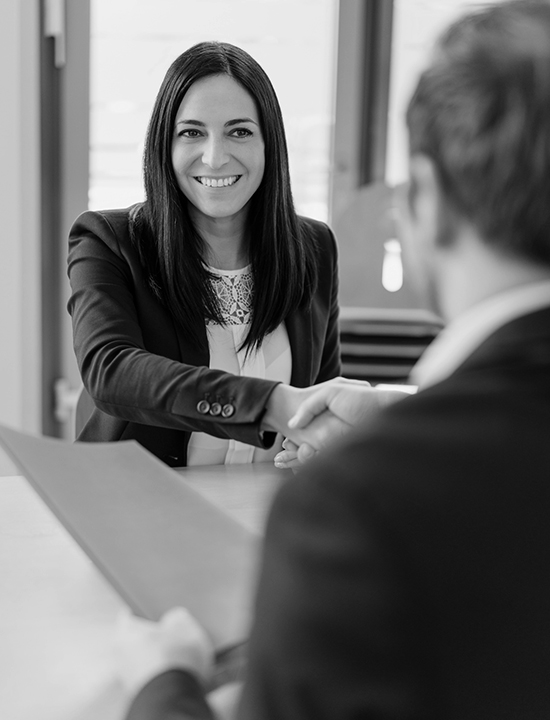 Woman at job interview shaking hands