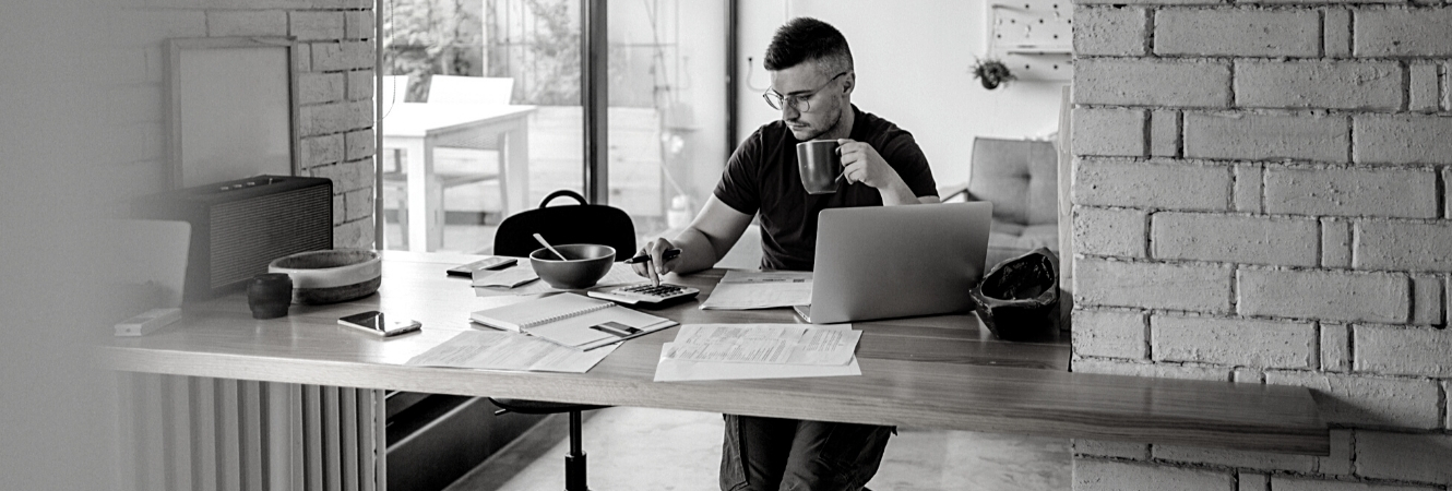 Guy at home doing financial things