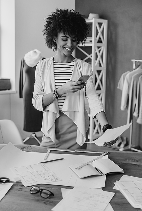 Small business women taking a photo with her smart phone of a reciept