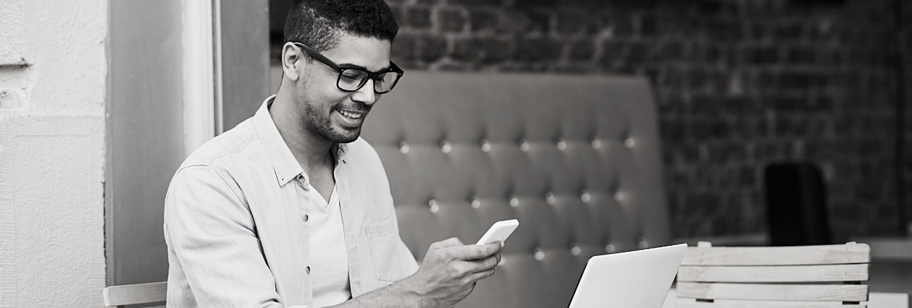 man looking at cell phone