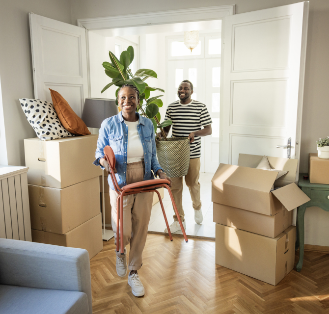 couple moving things into new home