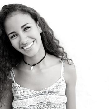 young girl wearing a tank top