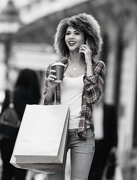 Women Shopping with coffee on her phone