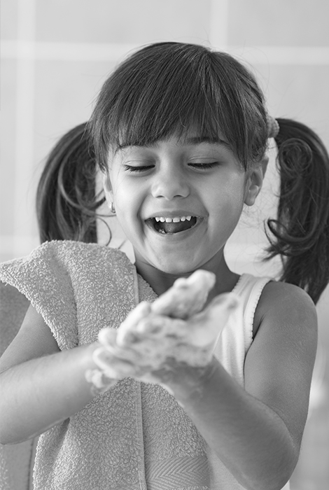 little girl washing her hands