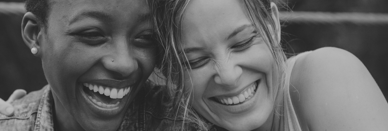 Two female friends laughing