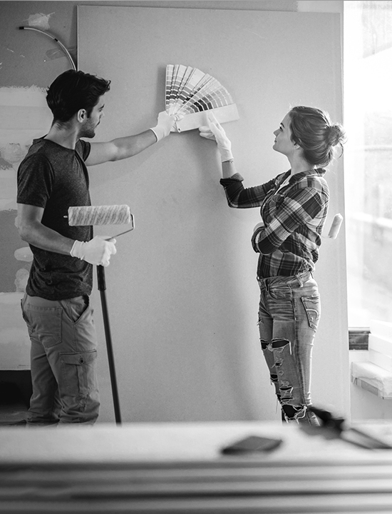 Couple at home deciding on what paint color to use.