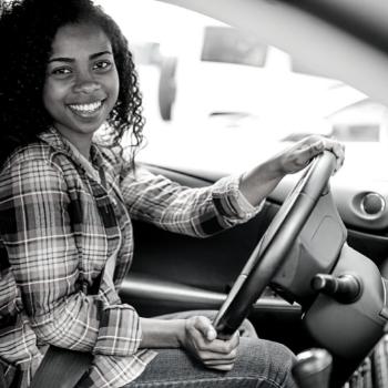 African American woman in drivers seat