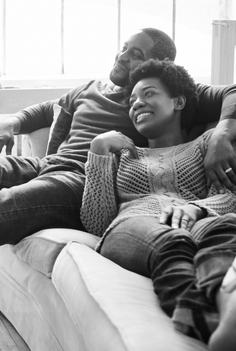 A young couple relaxing on a couch