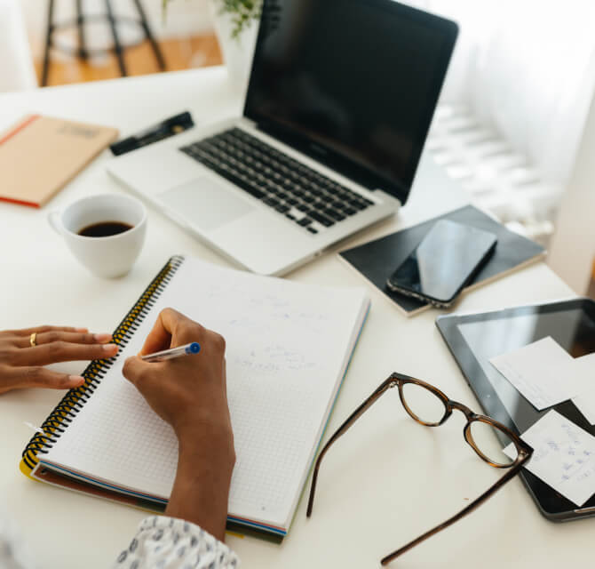 woman using notepad at desk